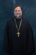 Fr Mark Doku